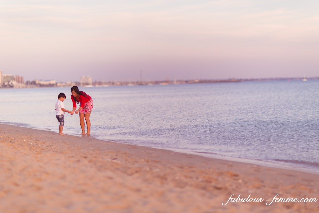mother with kid at beach in Melbourne