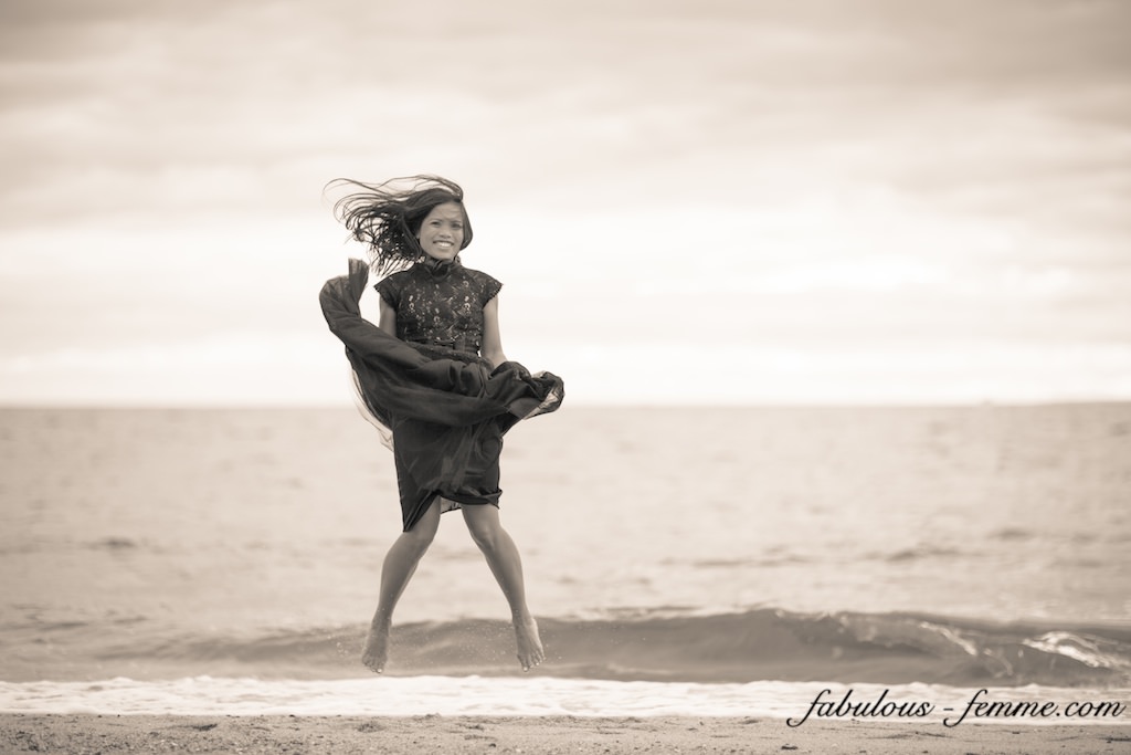 girl jumps on beach in dress - fashion blog melbourne