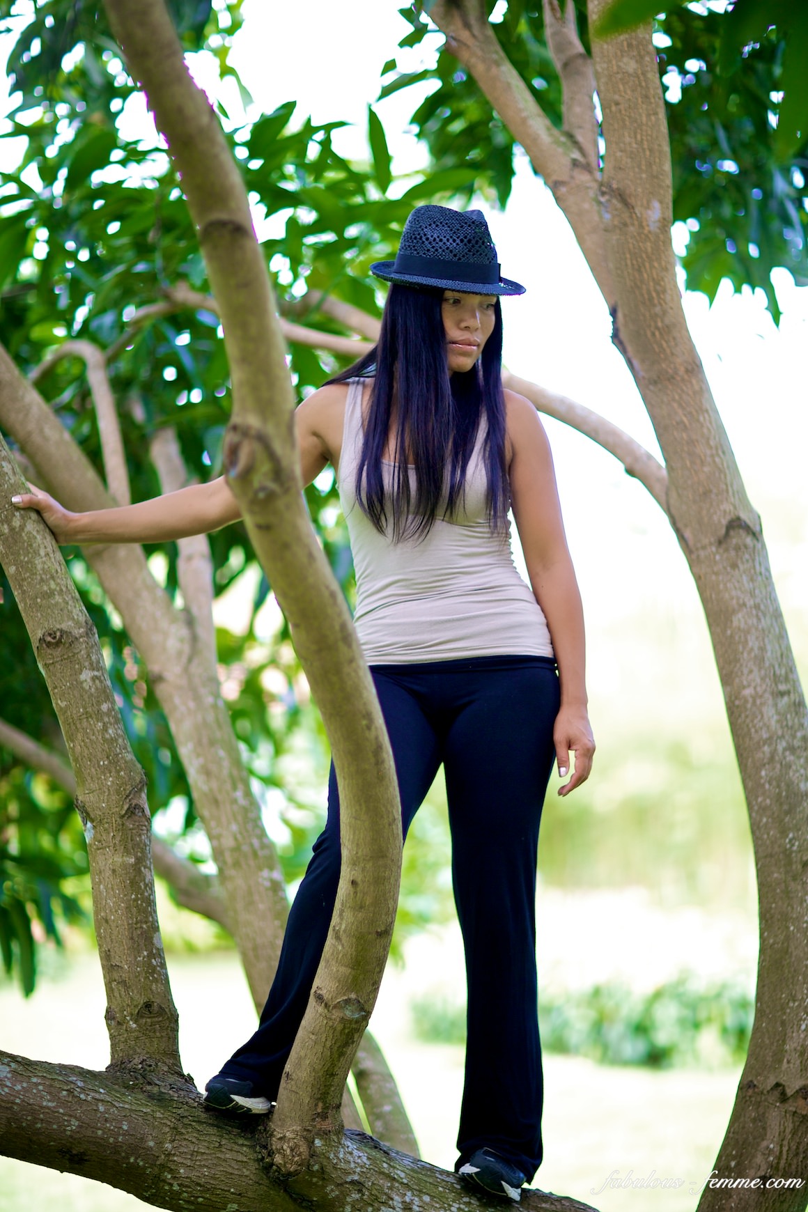girl standing in tree