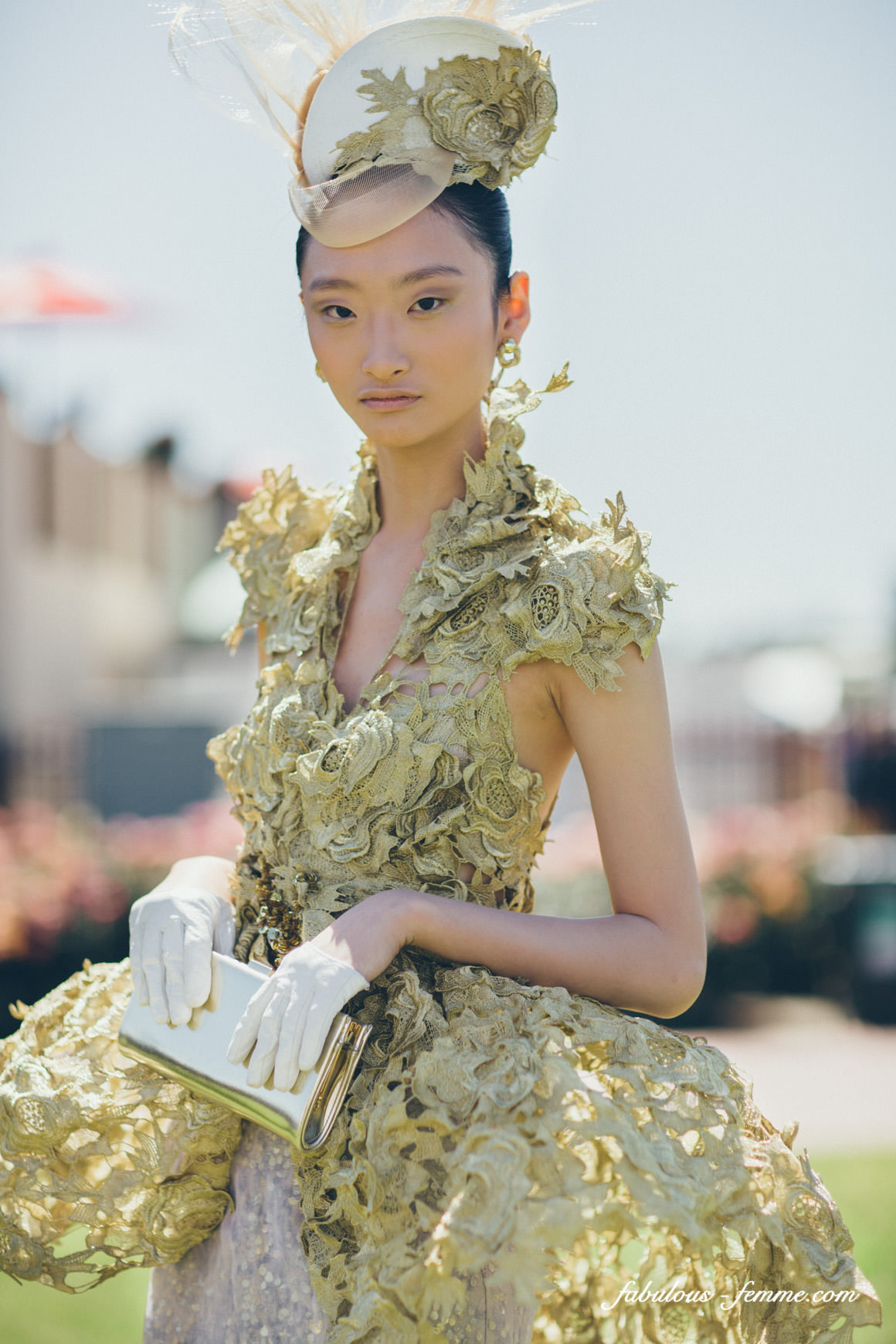 model presenting amazing gold dress at the melbourne cup designer award