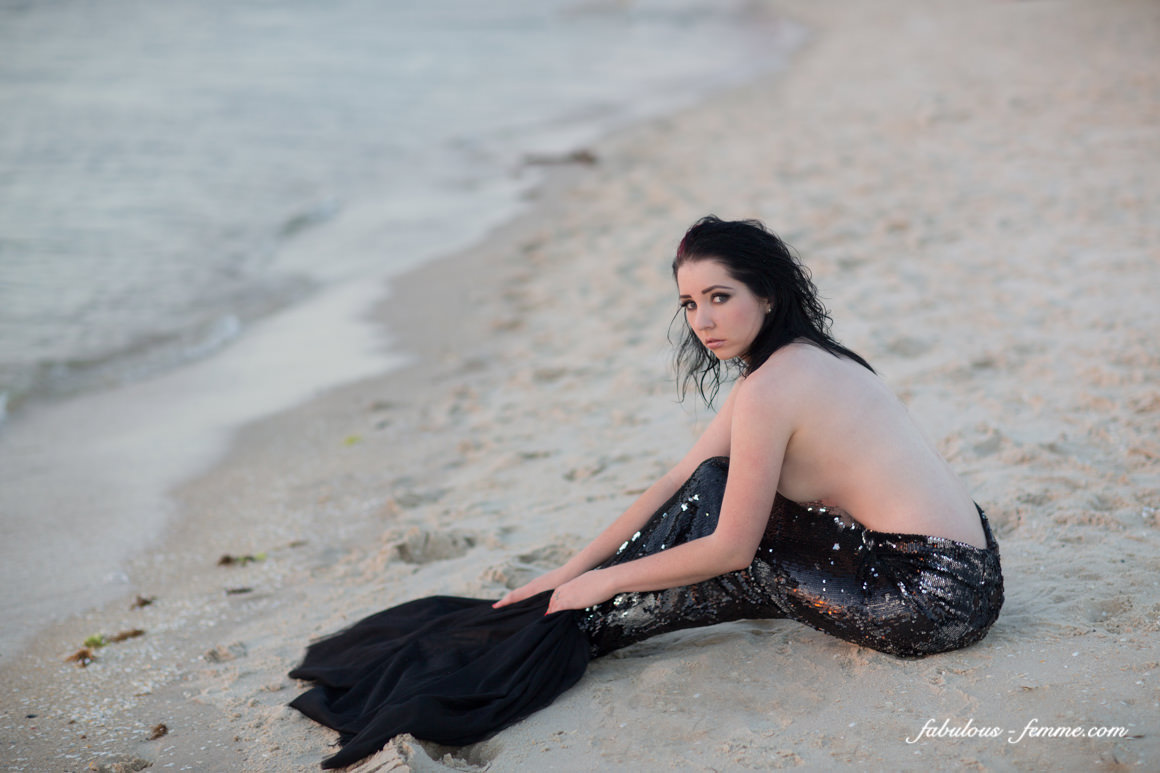 sitting beach mermaid in Australia