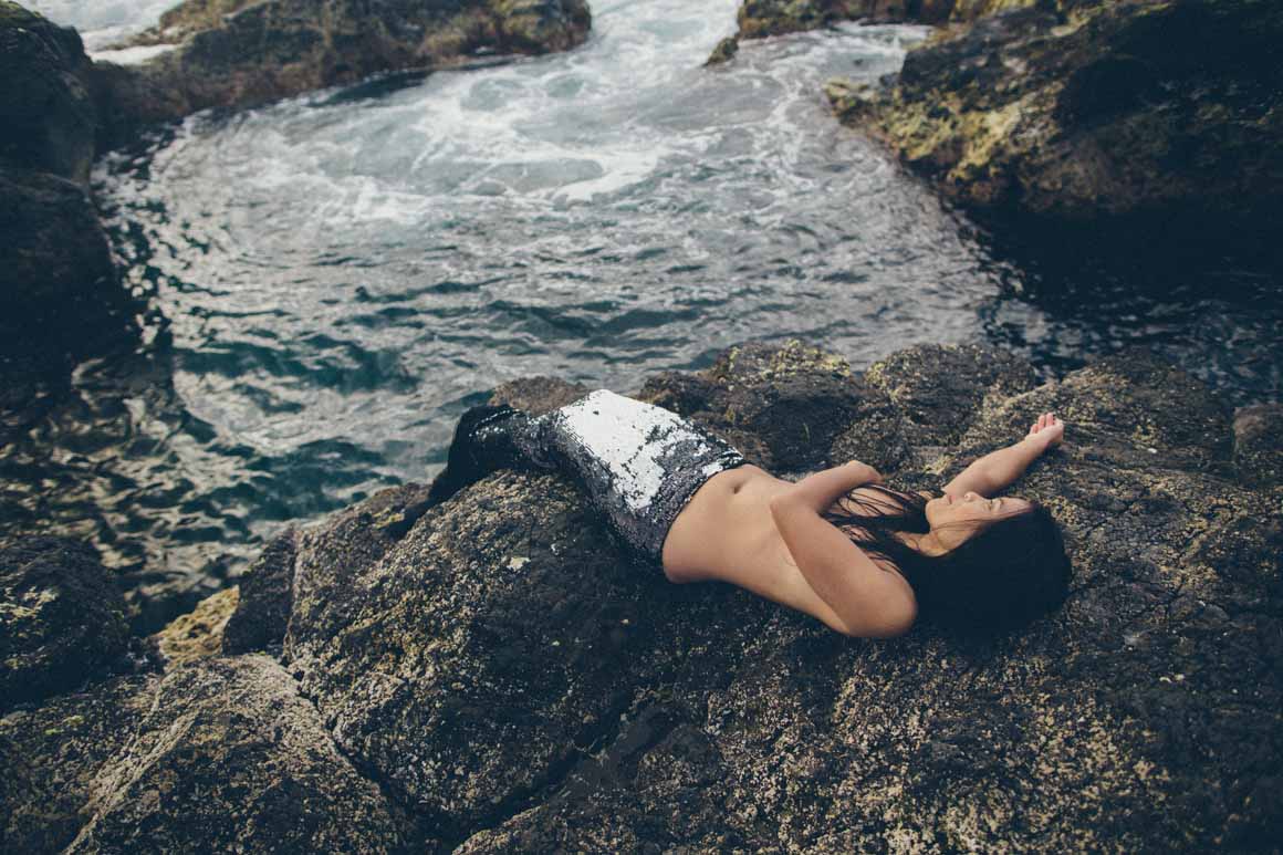 mermaid lying down watching the sea