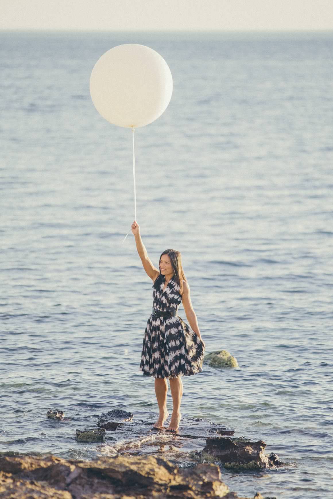 baloon at the beach - girl holding big balloon at the beach - photo prop