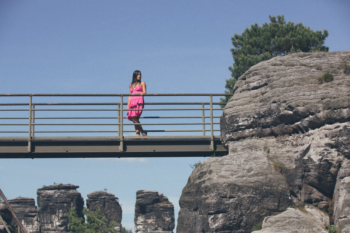 floating bridge - on rocks - girl in pink dress
