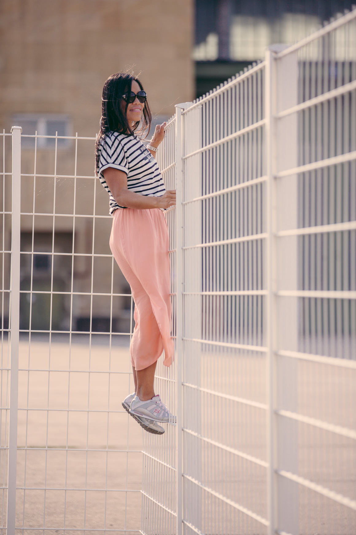 girl on fence - stripes fashion