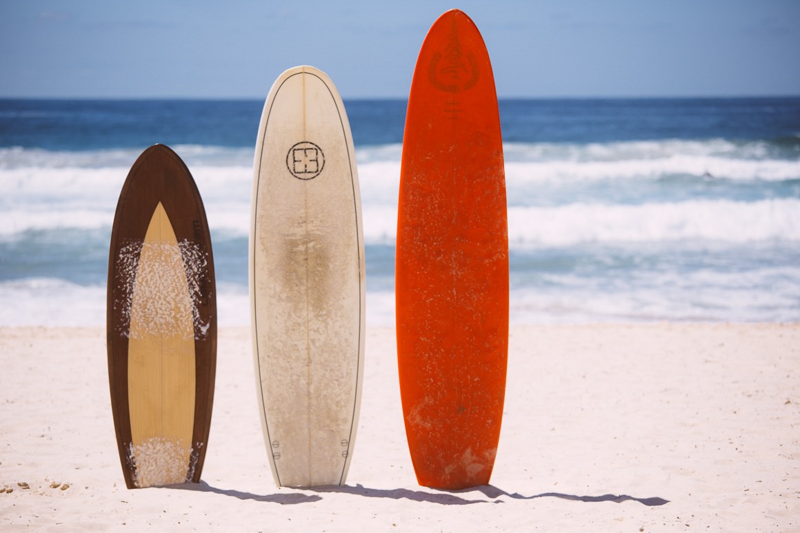surfboards in sand - lined up