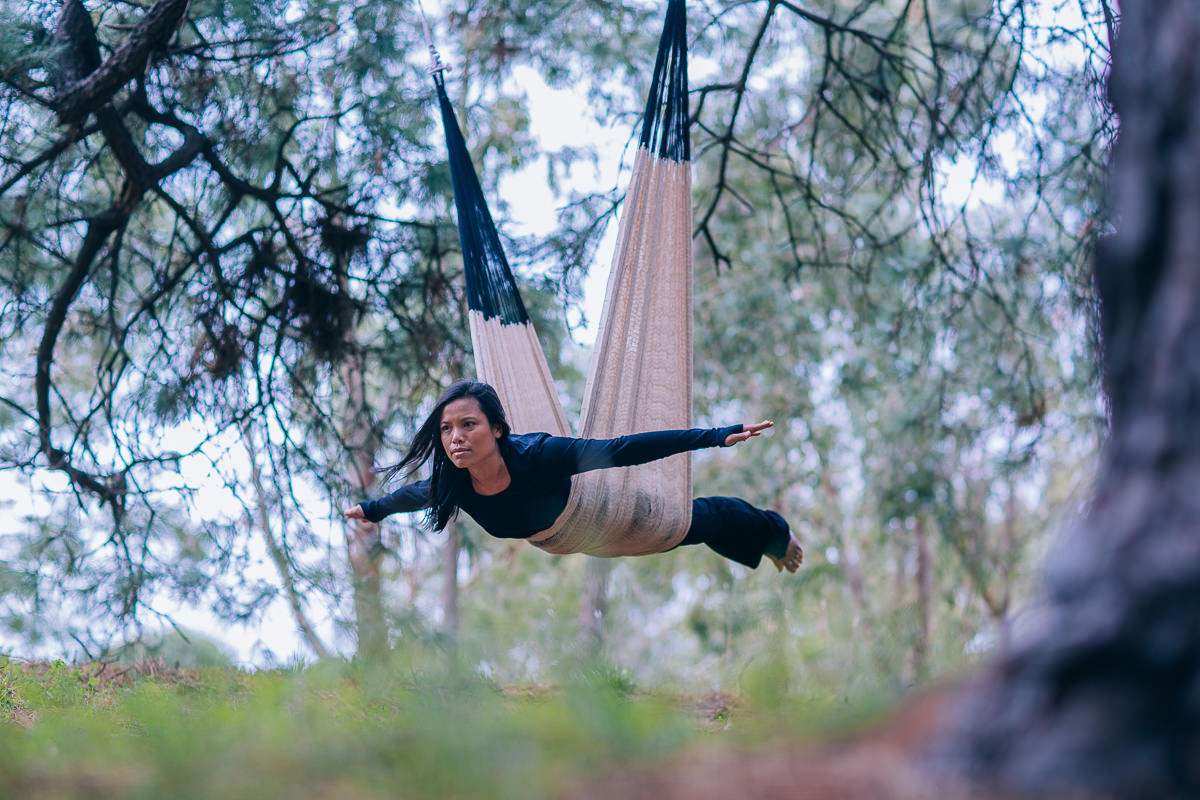 aerial yoga pose outddor - tree plane