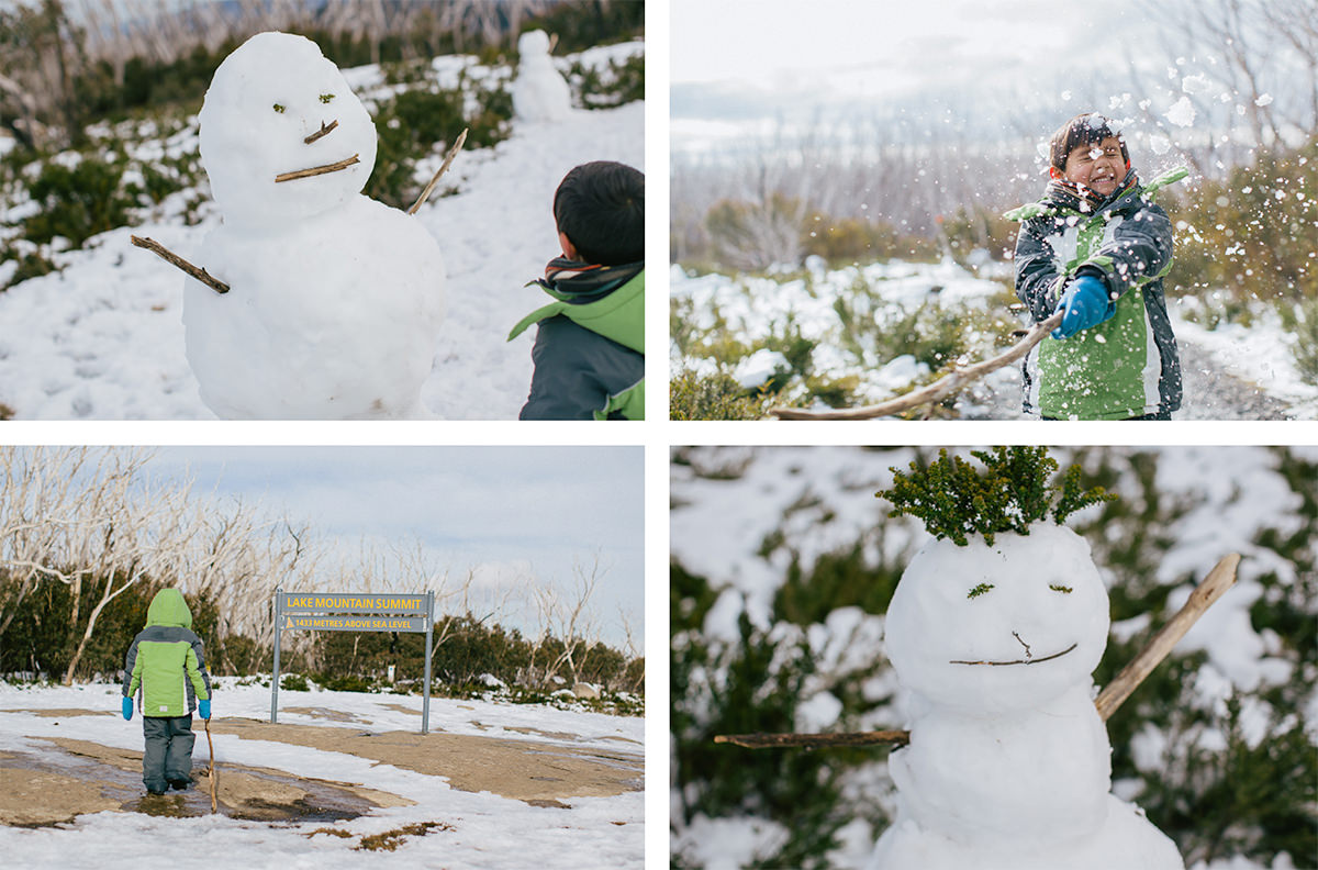 kids building snowman in lake mountain resort  - winter in melbourne