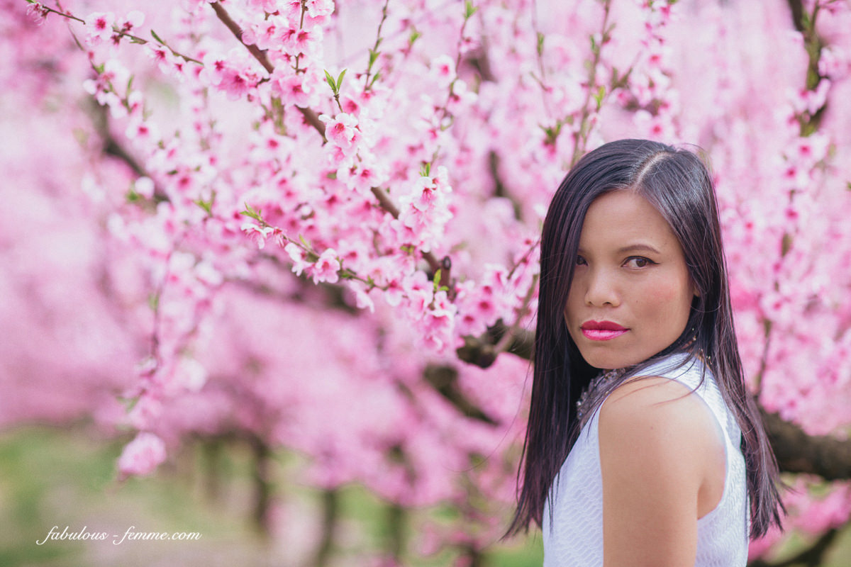 girl with blossom background - pink flowers