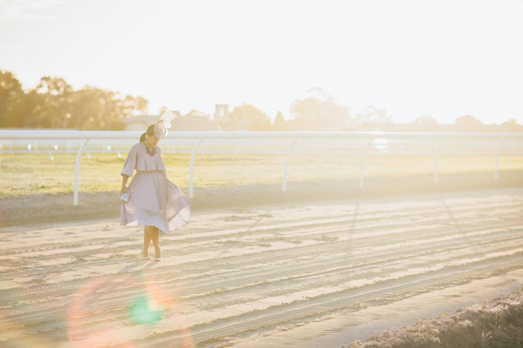 spring racing fashion - sunset shot on the racetrack