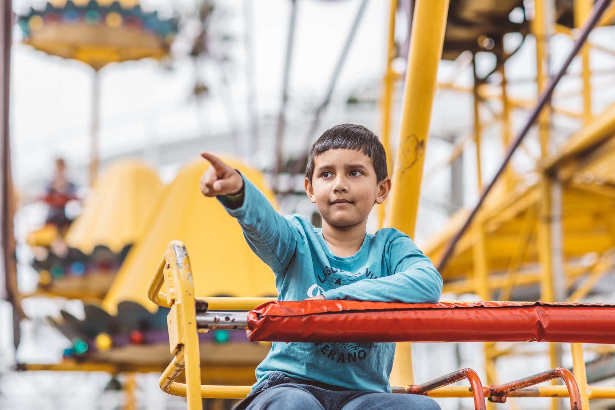kids having fun at luna park on ferris wheel