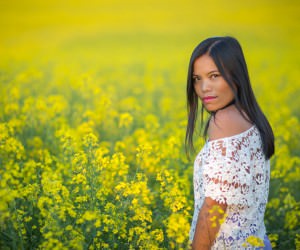 girl in endless yellow flower fields