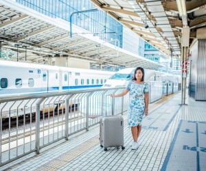 Paklite suitcase travel blogger in Japan on Shinkansen high speed train