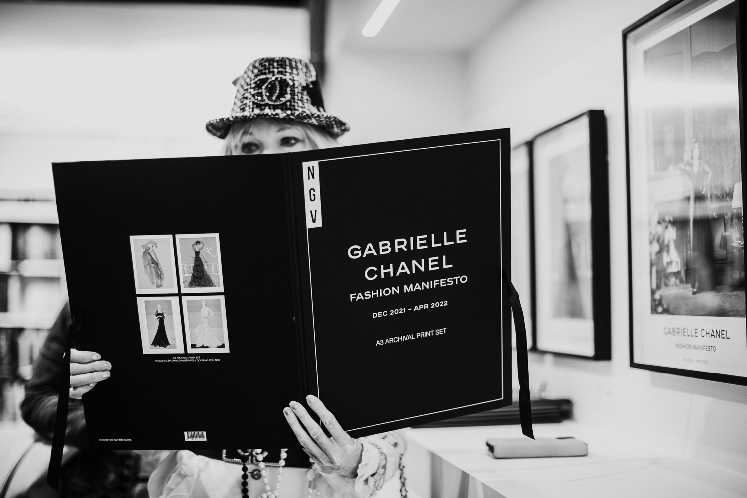 reading a Chanel book - in black and white
